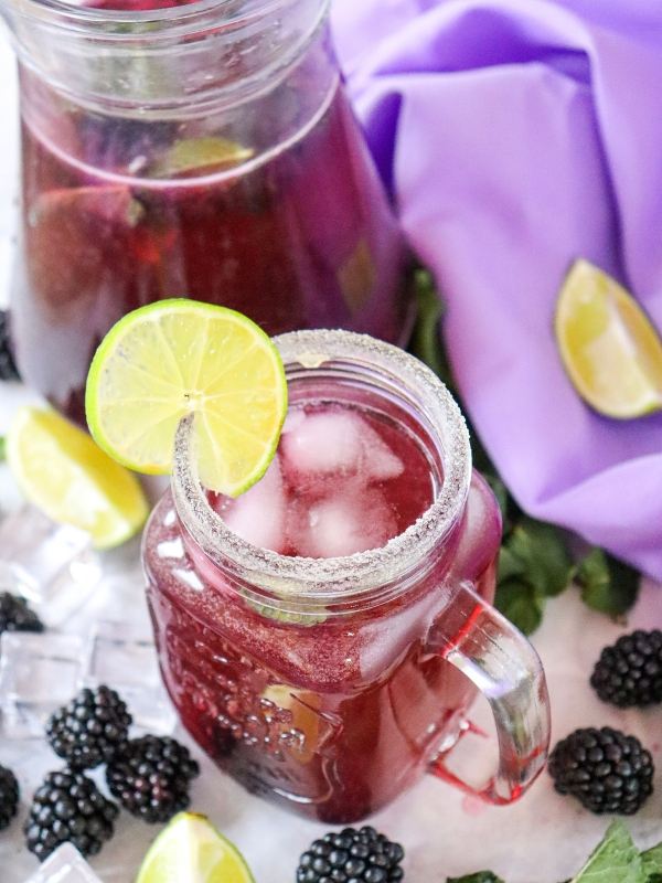 Stir-and-garnish-as-one-of-Blackberry-Mojito-Mocktail-recipe
