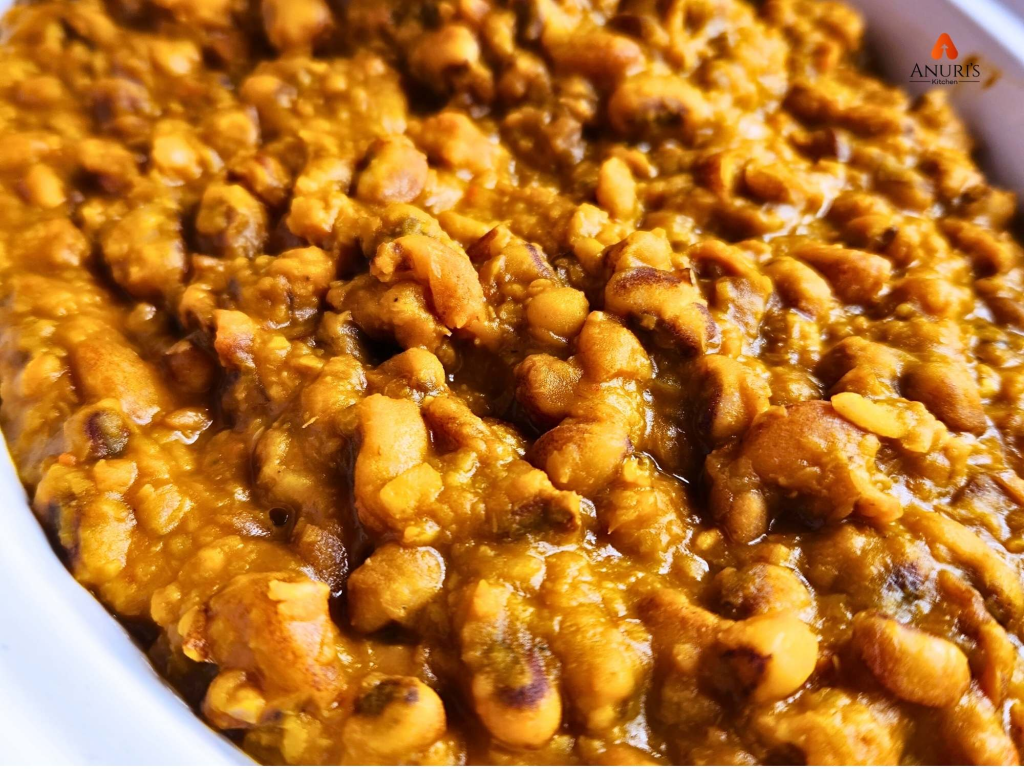 Well cooked beans porridge served in a white dish