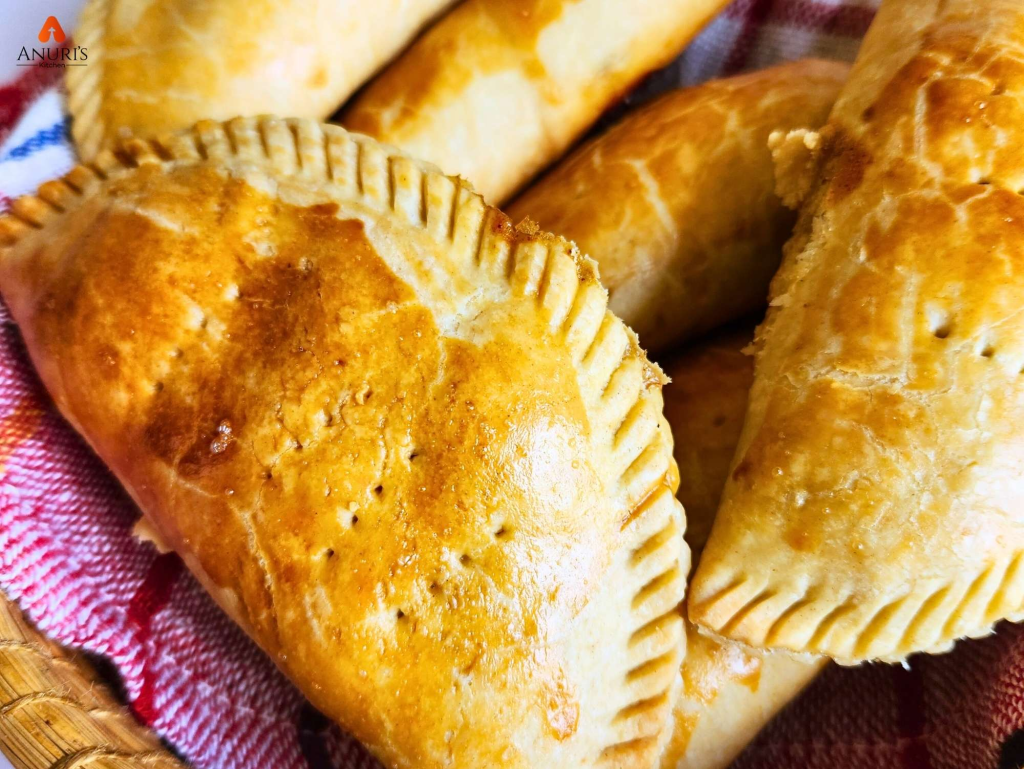 Image of a well baked meat pie served in a small basket