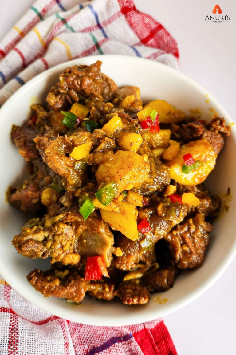 Curry Goat served on a white deep dish (1)